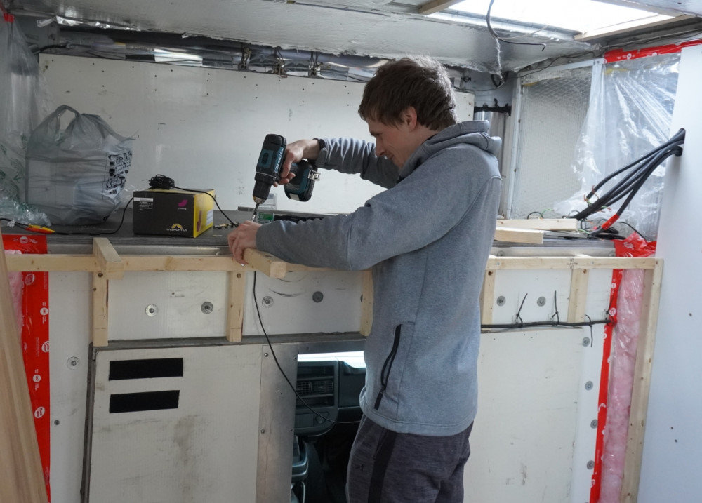 Moritz working on the bed frame.