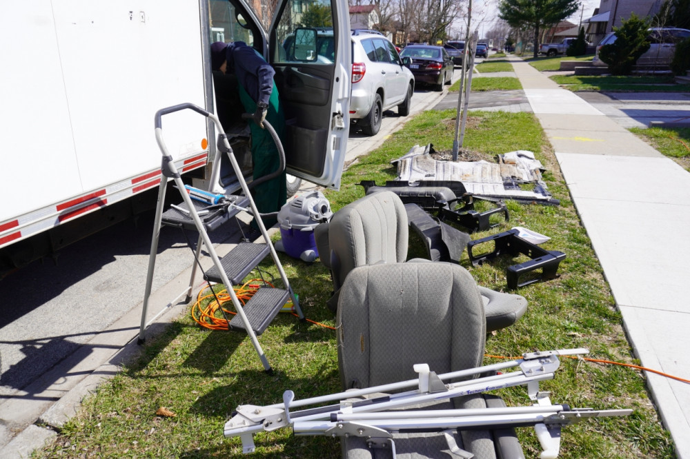 Everything pulled out and the vacuum sucking up dirt.