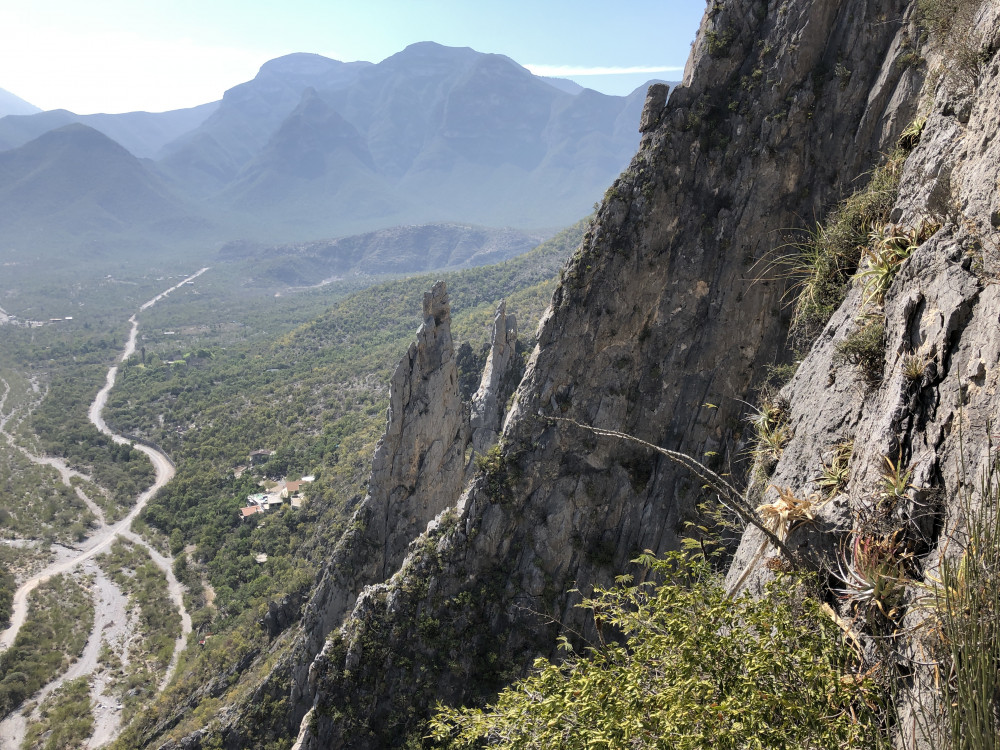 Chilling in the saddle of the spires, likely untangling rope. Moritz is on the left, facing right. Chiko is casually leaning on the rock, facing Moritz. Katy, I owe you another almond croissant in a container so Archer doesn't eat it.