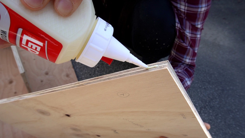 Applying wood glue to the edge prior to attaching.